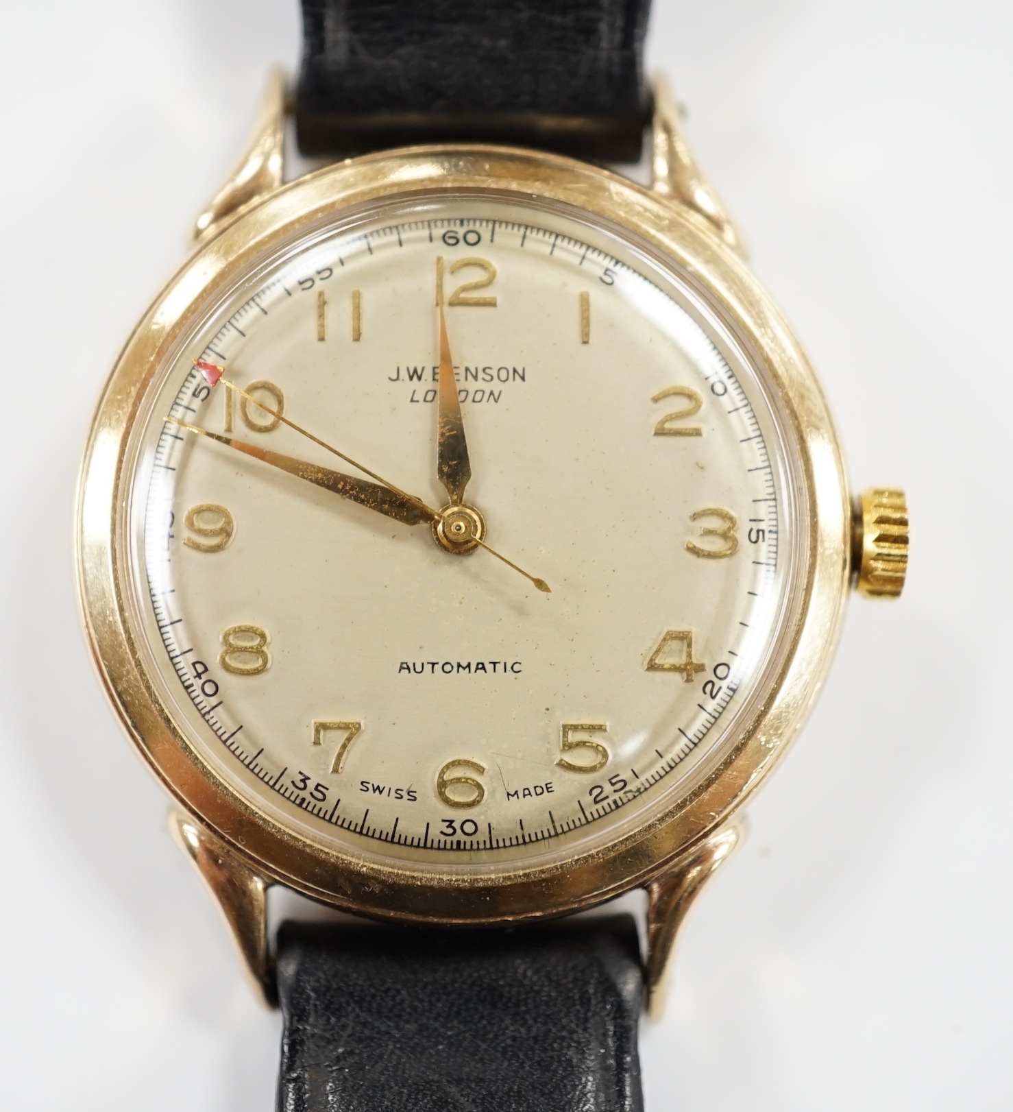 A gentleman's early 1950's 9ct gold J.W. Benson automatic wrist watch, case diameter 34mm, on associated leather strap, no buckle.